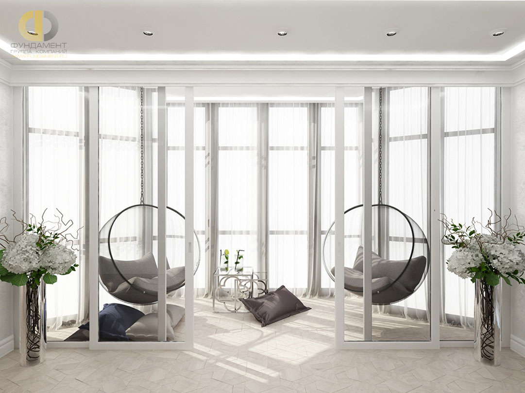 Интерьер балкона с подвесными креслами